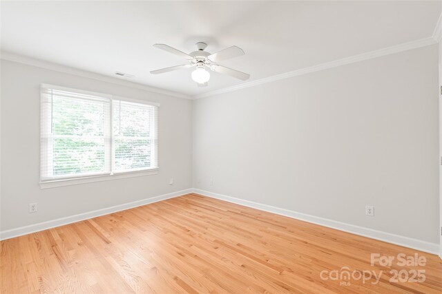 7301 Leharne Dr, Charlotte, NC 28270 - spare room with ornamental molding, ceiling fan, and light wood-style flooring
