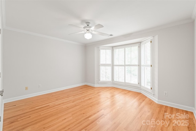 7301 Leharne Dr, Charlotte, NC 28270 - spare room with a ceiling fan, ornamental molding, and light wood-style floors