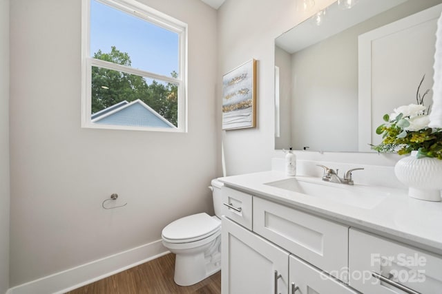 384 Speedway Pl, Concord, NC 28027 - half bathroom featuring vanity and wood finished floors