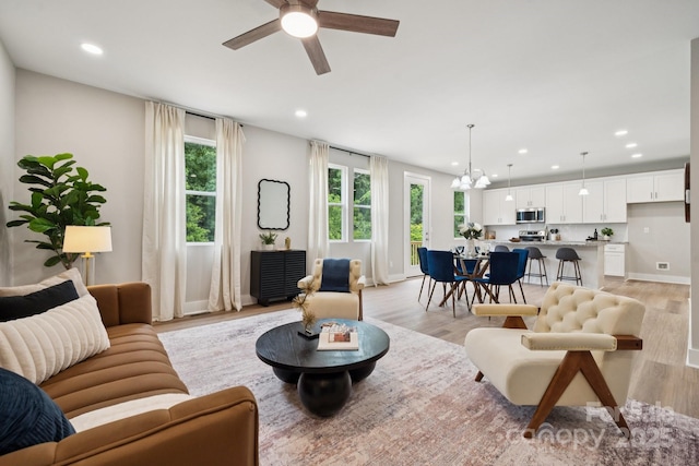 384 Speedway Pl, Concord, NC 28027 - living room with light wood-type flooring, ceiling fan, recessed lighting, and a chandelier