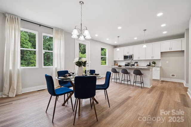 384 Speedway Pl, Concord, NC 28027 - dining room featuring light wood-style floors, recessed lighting, and a chandelier