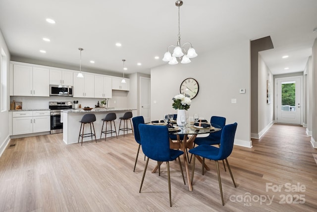 384 Speedway Pl, Concord, NC 28027 - dining space featuring recessed lighting, light wood-type flooring, and a chandelier