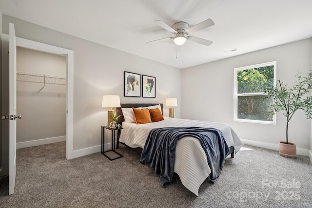 384 Speedway Pl, Concord, NC 28027 - bedroom featuring carpet, a walk in closet, and a ceiling fan