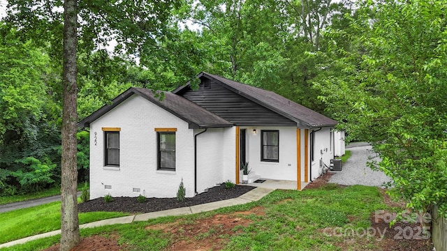 922 Maurice St, Monroe, NC 28112 - view of front facade featuring brick siding, crawl space, a front yard, and a shingled roof