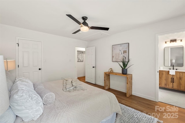 922 Maurice St, Monroe, NC 28112 - bedroom with light wood finished floors, attic access, ceiling fan, and ensuite bathroom