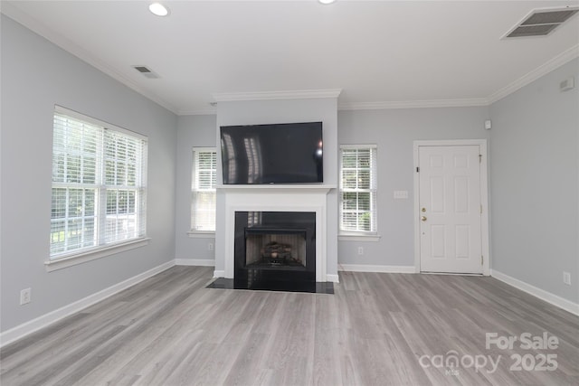 12321 Aquitaine St, Charlotte, NC 28277 - unfurnished living room featuring wood finished floors, ornamental molding, a fireplace with flush hearth, and recessed lighting