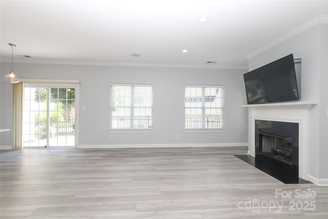 12321 Aquitaine St, Charlotte, NC 28277 - unfurnished living room featuring light wood-type flooring, a fireplace with flush hearth, crown molding, and recessed lighting