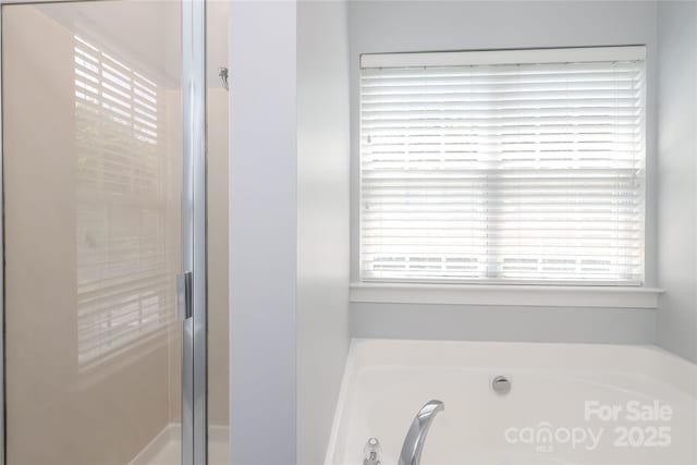 12321 Aquitaine St, Charlotte, NC 28277 - full bathroom featuring a bath and a stall shower
