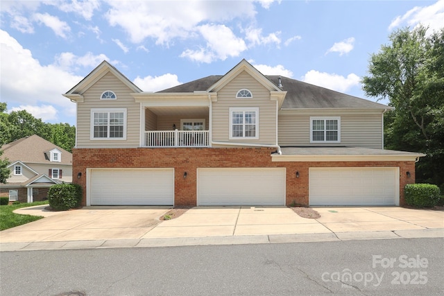 12321 Aquitaine St, Charlotte, NC 28277 - view of front of property with brick siding, an attached garage, and concrete driveway