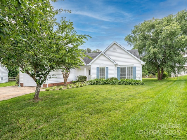 703 Bradberry Ln, Indian Trail, NC 28079 - view of front of property with a front lawn, a shingled roof, concrete driveway, and a garage