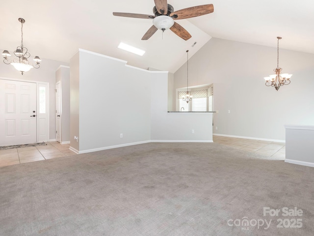 703 Bradberry Ln, Indian Trail, NC 28079 - unfurnished living room with a chandelier, carpet flooring, high vaulted ceiling, a ceiling fan, and tile patterned flooring