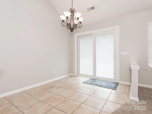 703 Bradberry Ln, Indian Trail, NC 28079 - doorway to outside with light tile patterned floors, a chandelier, and lofted ceiling