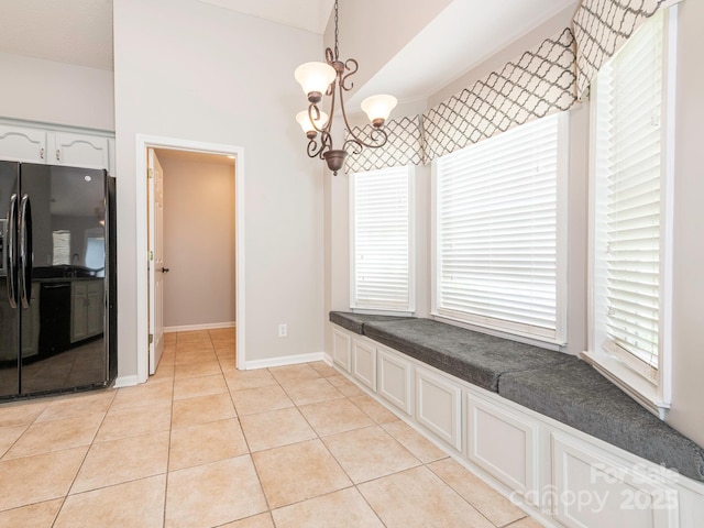 703 Bradberry Ln, Indian Trail, NC 28079 - unfurnished dining area with light tile patterned flooring and baseboards