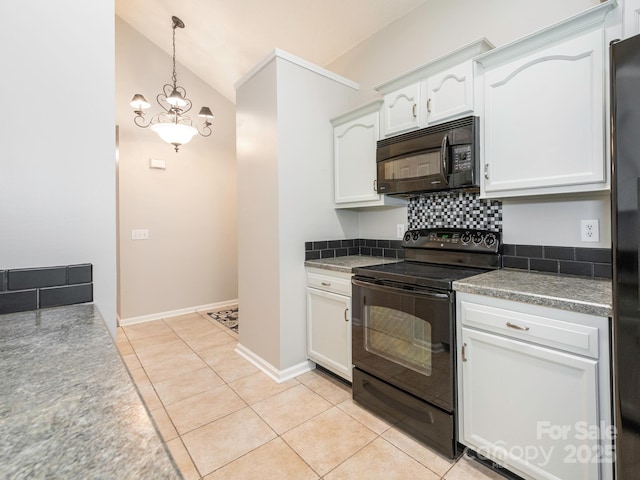 703 Bradberry Ln, Indian Trail, NC 28079 - kitchen with black appliances, white cabinets, vaulted ceiling, hanging light fixtures, and decorative backsplash