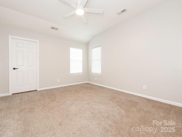 703 Bradberry Ln, Indian Trail, NC 28079 - spare room featuring carpet floors, ceiling fan, and vaulted ceiling