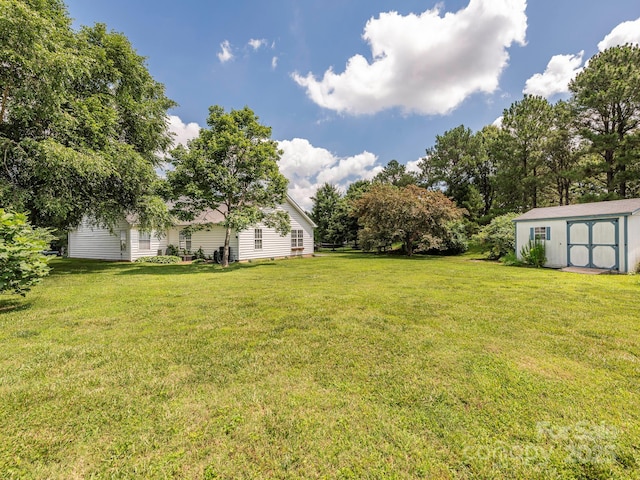 703 Bradberry Ln, Indian Trail, NC 28079 - view of green lawn featuring a storage unit