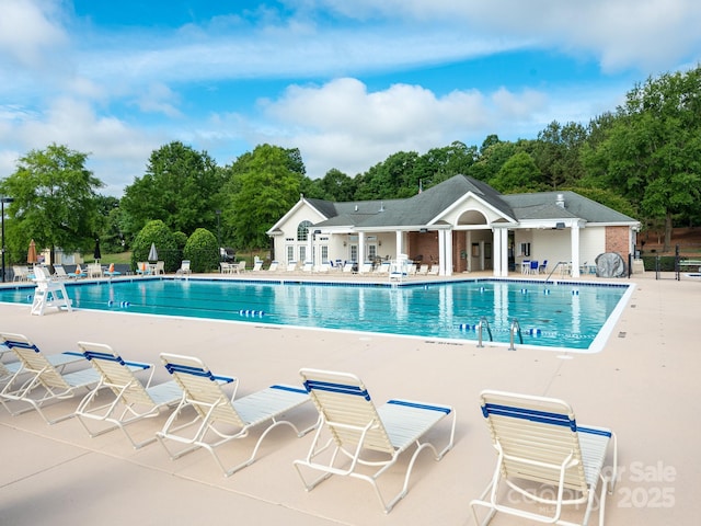 703 Bradberry Ln, Indian Trail, NC 28079 - community pool with a patio area and view of scattered trees