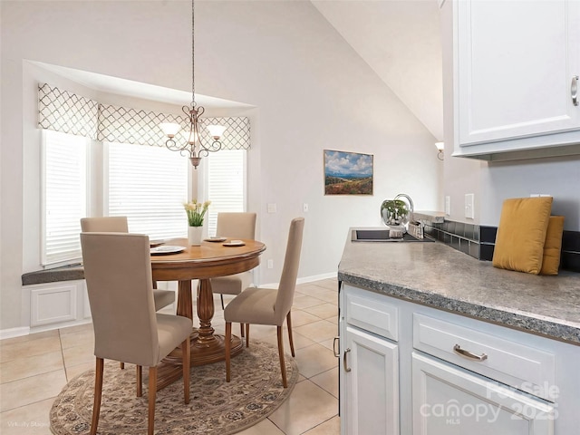 703 Bradberry Ln, Indian Trail, NC 28079 - dining room with a chandelier, light tile patterned flooring, and lofted ceiling