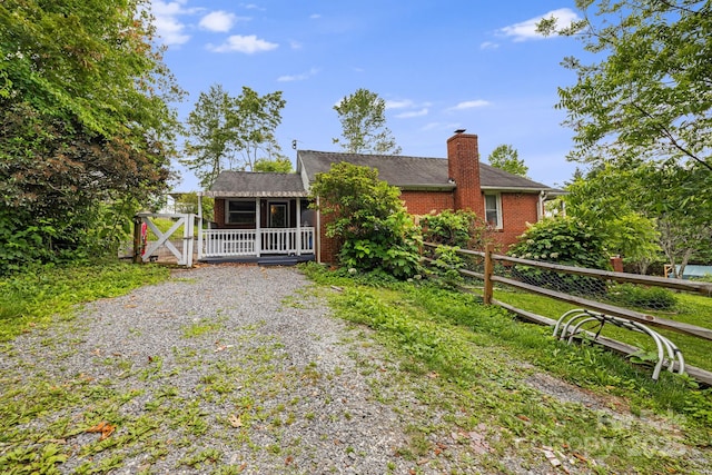 1271 Upper Brush Creek Rd, Fairview, NC 28730 - view of front facade featuring a chimney and brick siding