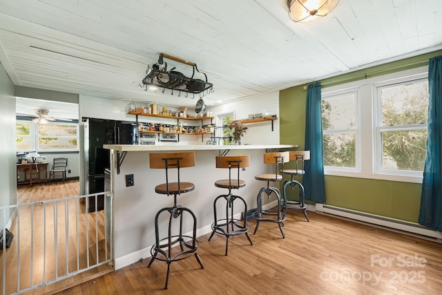1271 Upper Brush Creek Rd, Fairview, NC 28730 - kitchen featuring freestanding refrigerator, wood ceiling, light wood finished floors, open shelves, and a baseboard radiator