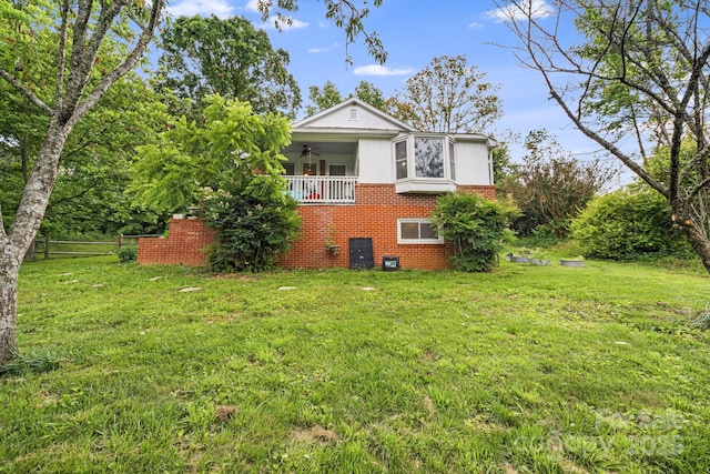 1271 Upper Brush Creek Rd, Fairview, NC 28730 - view of property exterior with brick siding, ceiling fan, and a yard