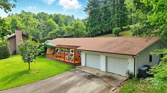 155 John Thomas Dr, Boone, NC 28607 - view of front of home featuring driveway, a front yard, an attached garage, and roof with shingles