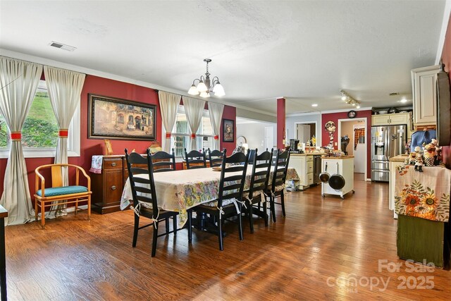 155 John Thomas Dr, Boone, NC 28607 - dining area with a chandelier, ornamental molding, and wood finished floors