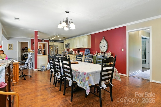 155 John Thomas Dr, Boone, NC 28607 - dining space with a chandelier, wood finished floors, and crown molding