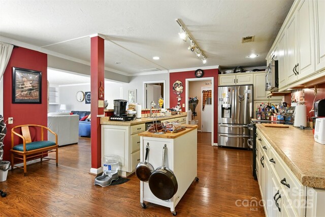 155 John Thomas Dr, Boone, NC 28607 - kitchen featuring stainless steel appliances, dark wood-style flooring, crown molding, track lighting, and recessed lighting