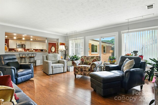 155 John Thomas Dr, Boone, NC 28607 - living room featuring a textured ceiling, ornamental molding, and wood finished floors
