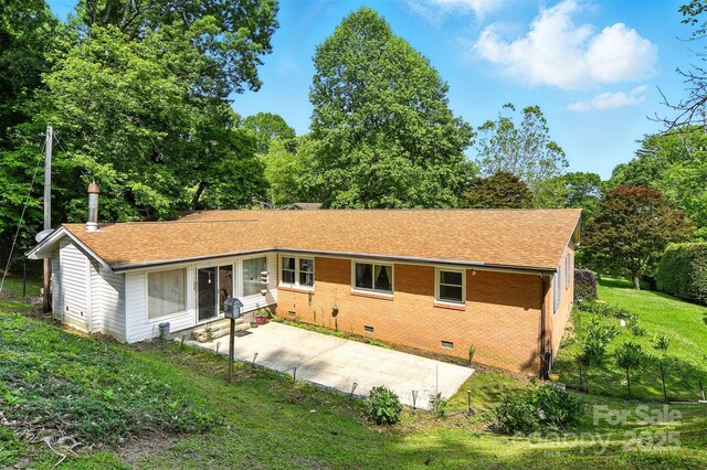 155 John Thomas Dr, Boone, NC 28607 - back of house featuring crawl space, a patio, a lawn, brick siding, and roof with shingles