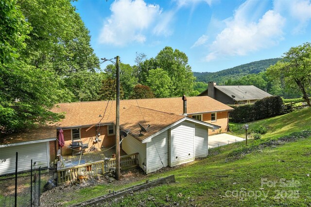 155 John Thomas Dr, Boone, NC 28607 - rear view of house featuring brick siding and roof with shingles
