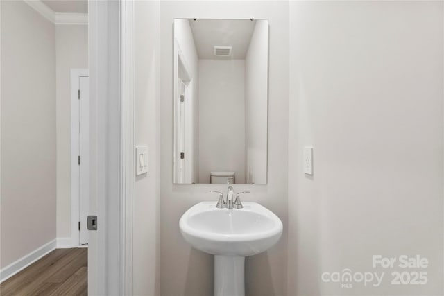 415 Luna Ln, Shelby, NC 28152 - bathroom featuring wood finished floors and ornamental molding