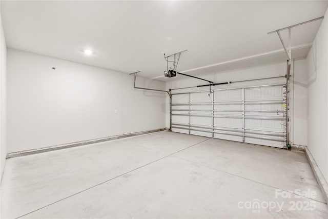 415 Luna Ln, Shelby, NC 28152 - garage featuring a garage door opener and baseboards