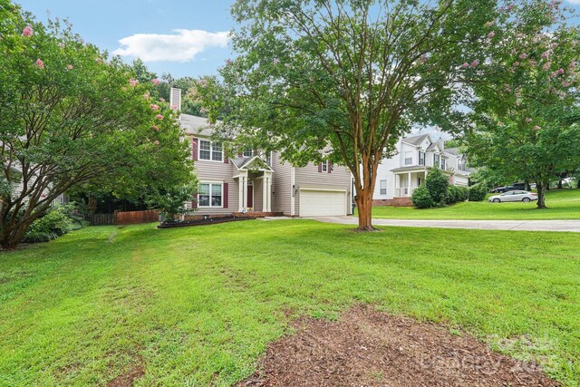 8618 Sam Dee Rd, Charlotte, NC 28215 - view of front of property featuring a garage, driveway, a front yard, and a chimney