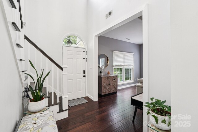 8618 Sam Dee Rd, Charlotte, NC 28215 - entryway with dark wood-style floors and stairway