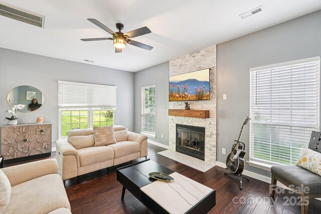 8618 Sam Dee Rd, Charlotte, NC 28215 - living room with a ceiling fan, wood finished floors, and a stone fireplace