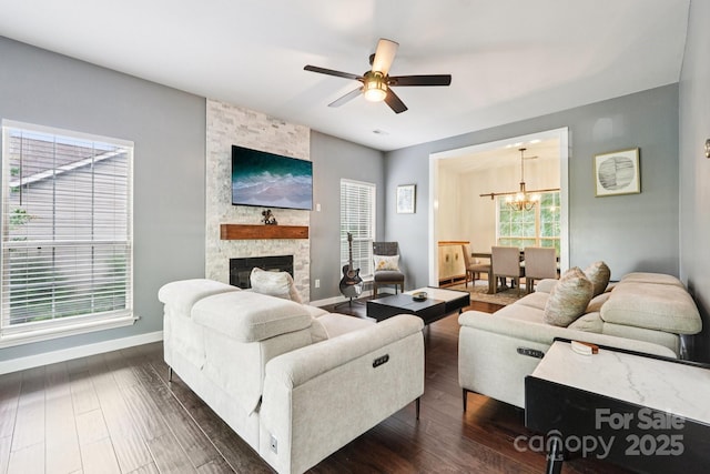 8618 Sam Dee Rd, Charlotte, NC 28215 - living area featuring a chandelier, a ceiling fan, dark wood finished floors, and a fireplace