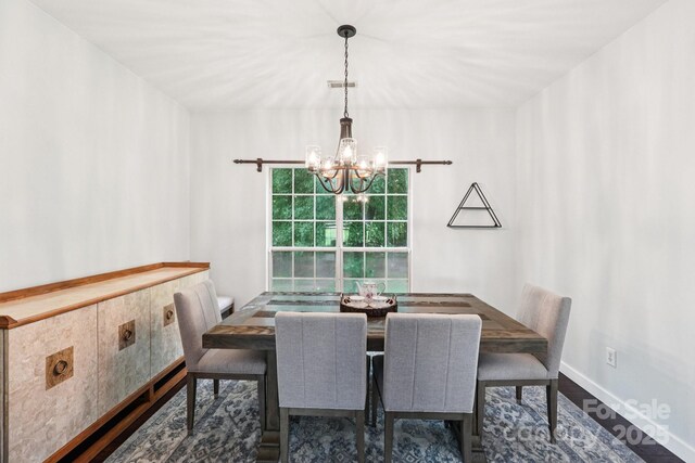 8618 Sam Dee Rd, Charlotte, NC 28215 - dining space featuring a chandelier and wood finished floors