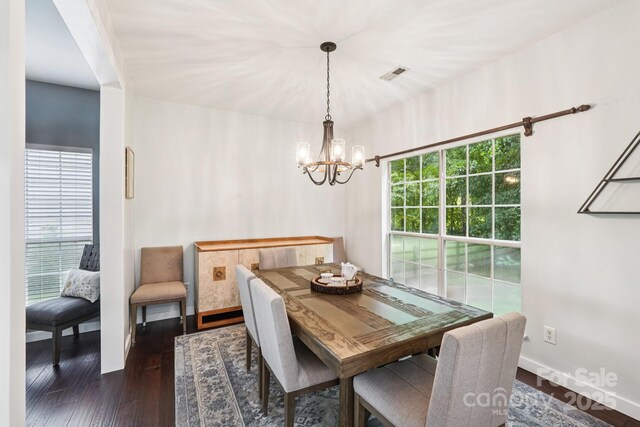 8618 Sam Dee Rd, Charlotte, NC 28215 - dining space with a chandelier and wood finished floors