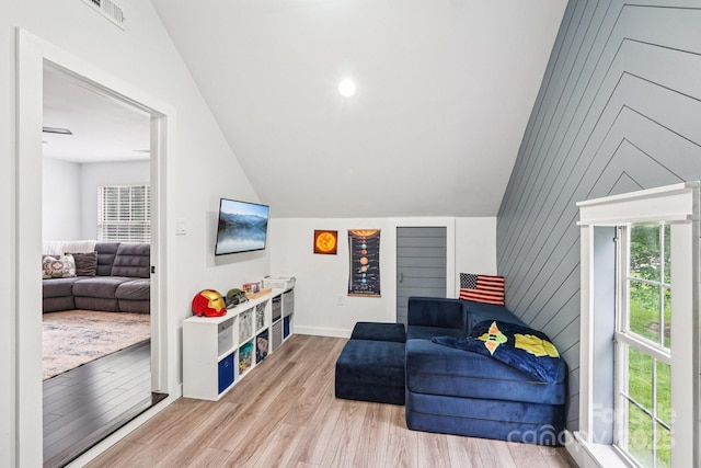 8618 Sam Dee Rd, Charlotte, NC 28215 - sitting room with vaulted ceiling, plenty of natural light, and wood finished floors