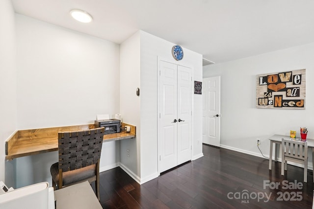 8618 Sam Dee Rd, Charlotte, NC 28215 - office area featuring built in desk and dark wood finished floors
