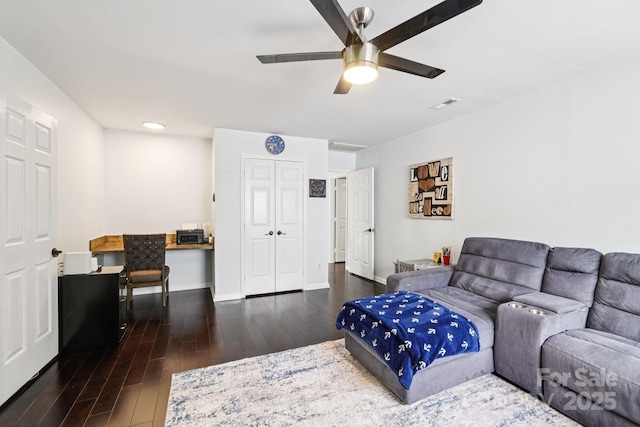 8618 Sam Dee Rd, Charlotte, NC 28215 - living room with wood finished floors, ceiling fan, and a desk