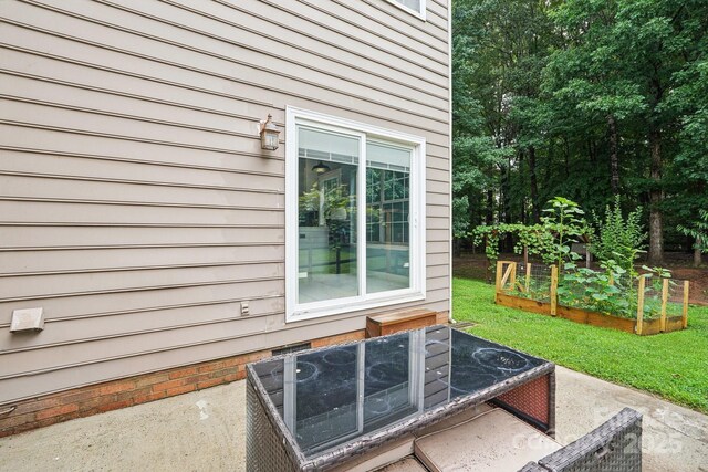 8618 Sam Dee Rd, Charlotte, NC 28215 - exterior view of a vegetable garden and a central AC unit