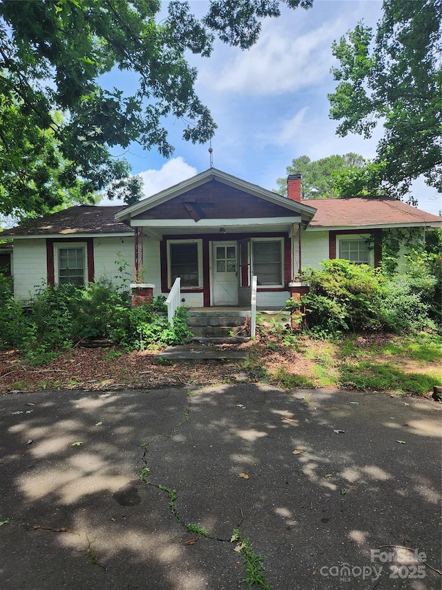 423 Tot Dellinger Rd, Cherryville, NC 28021 - view of front of home featuring a chimney and covered porch