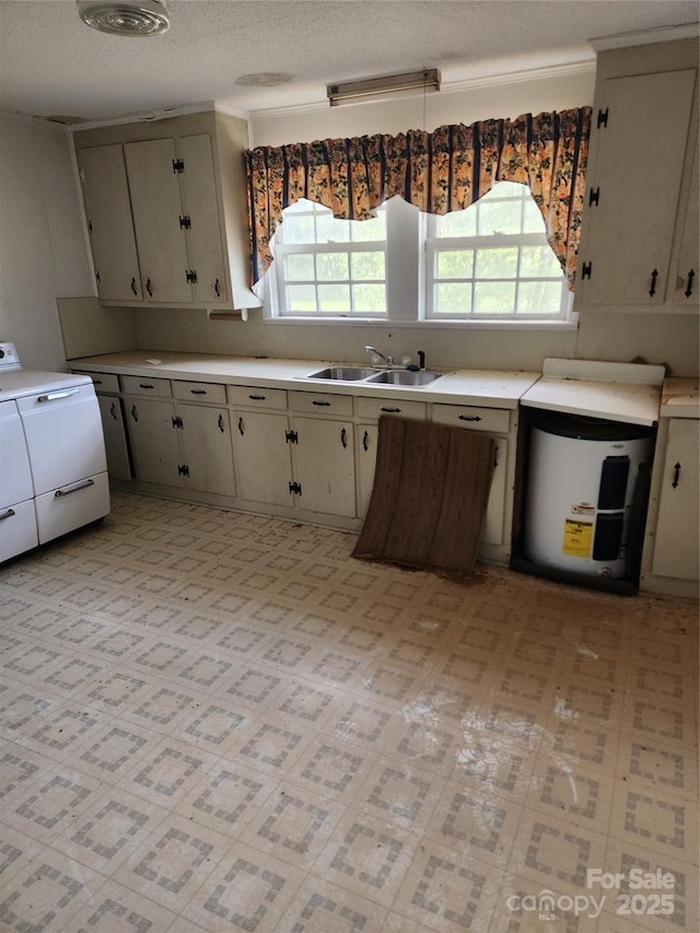 423 Tot Dellinger Rd, Cherryville, NC 28021 - kitchen with healthy amount of natural light, washer / clothes dryer, light countertops, a textured ceiling, and light floors