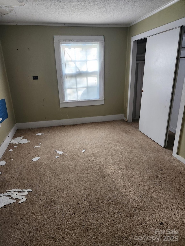 423 Tot Dellinger Rd, Cherryville, NC 28021 - unfurnished bedroom featuring a textured ceiling, carpet, a closet, and ornamental molding