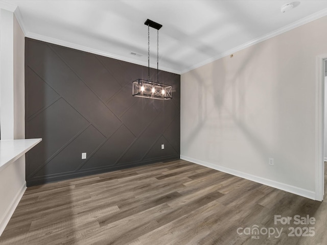 17136 Red Feather Dr, Charlotte, NC 28277 - unfurnished dining area featuring crown molding and wood finished floors