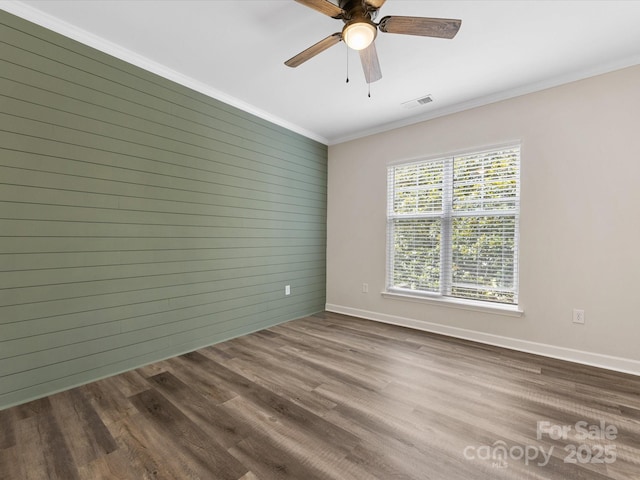 17136 Red Feather Dr, Charlotte, NC 28277 - unfurnished room featuring dark wood-style flooring, ornamental molding, and a ceiling fan