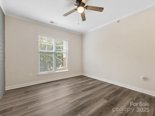 17136 Red Feather Dr, Charlotte, NC 28277 - spare room with crown molding, ceiling fan, and dark wood-style flooring